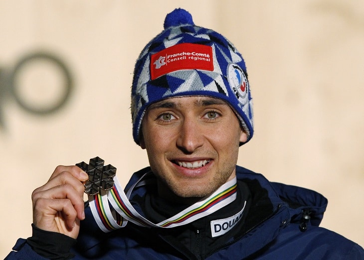 Chappuis of France poses with his bronze medal after the Nordic Combined men's Individual Gundersen 10km competition at the Nordic Ski World Championships in the northern mountain resort of Cavalese